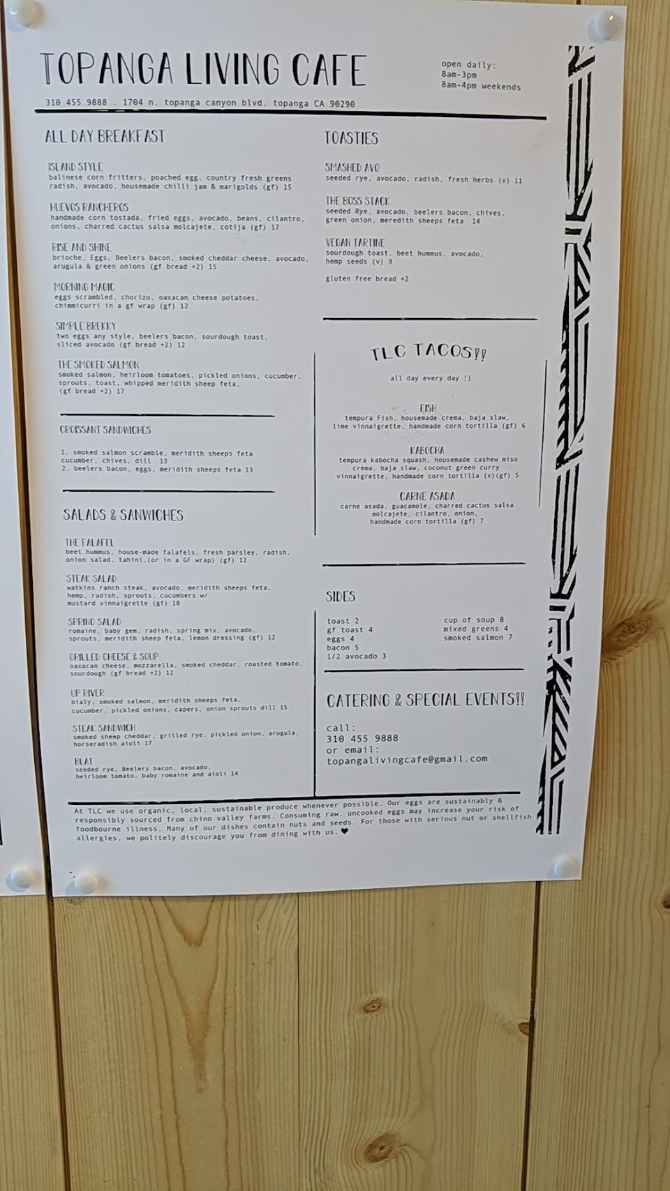 Menu board with coffee, buns, and breakfast dishes.